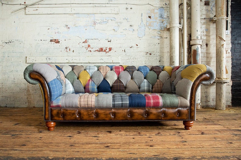 3 seater Patchwork Chesterfield Sofa. Shown in a range of multi coloured wool blend fabrics with contrasting antique tan leather details.