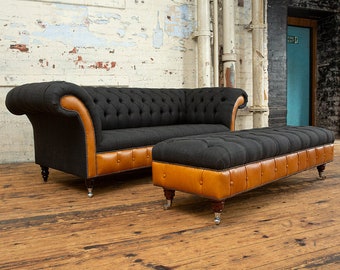 May include: A black and brown tufted sofa with a matching ottoman. The sofa and ottoman have a tufted design and are upholstered in a dark fabric with brown leather accents.