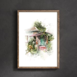 May include: Watercolor painting of a house with a porch, framed in a natural wood. The porch has a green door and is surrounded by lush greenery. The artwork has a soft, artistic style with muted colors.
