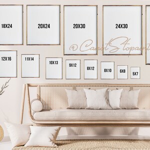 May include: A selection of framed art prints in sizes such as 40x50 cm, 45x60 cm, and 50x60 cm, displayed on a wall. The frames have a natural wood finish. The image also shows a sofa with pillows and a woven basket.