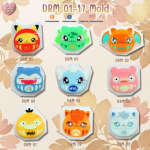 May include: A collection of nine colorful silicone molds, each featuring a unique cartoon character design. The molds are in various shapes and colors, including red, green, orange, blue, and yellow. The text "DRM 01-17 Mold" is at the top.