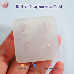 May include: A clear, square mold with four seahorse designs. The text "DDD 79 Sea horses Mold" is printed at the top. The mold has the "Punfun Studio" logo and social media handles at the bottom.