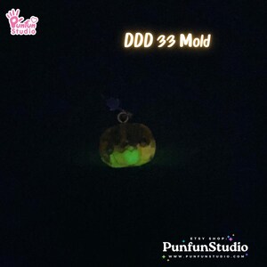 May include: A glow-in-the-dark pumpkin-shaped mold for crafting. The mold is made of a clear, flexible material and is shown in a dark setting, glowing green.