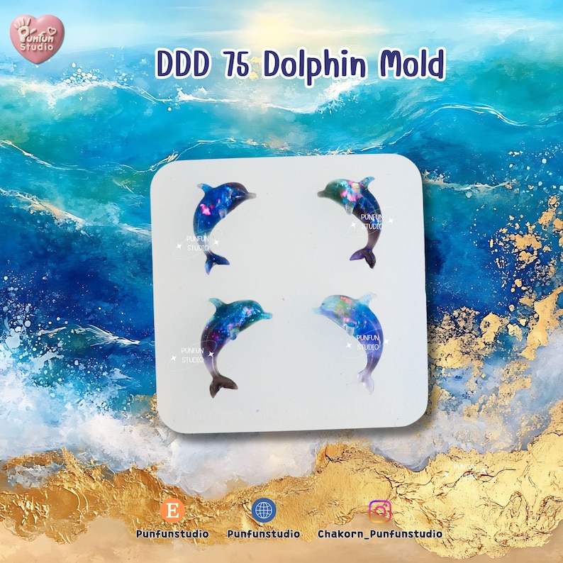 May include: A white square mold with four dolphin designs. Each dolphin is a mix of blue, purple, and pink, with a galaxy-like pattern. The text "DDD 75 Dolphin Mold" is at the top. The background is a watercolor ocean scene.