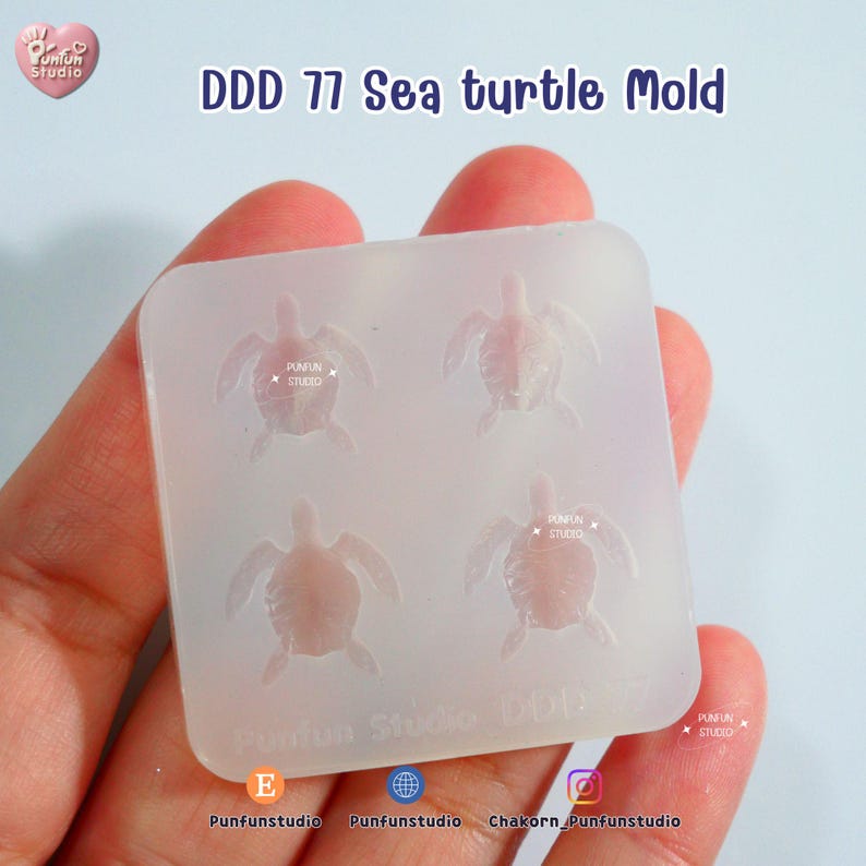 May include: A clear silicone mold with four sea turtle designs. The mold has the text "DDD 77 Sea turtle Mold" and "Punfun Studio" printed on it. The mold is held in a hand.