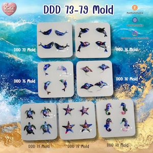 May include: A collection of silicone molds featuring marine life designs, including dolphins, sea turtles, starfish, and seahorses. The molds are arranged on a blue and gold background, with the text "DDD 73-79 Mold" at the top.