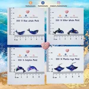 May include: Four resin molds featuring marine life: a blue whale, a killer whale, a dolphin, and manta rays. Each mold is displayed on a white card with a centimeter ruler for scale. The molds are in shades of blue and purple.