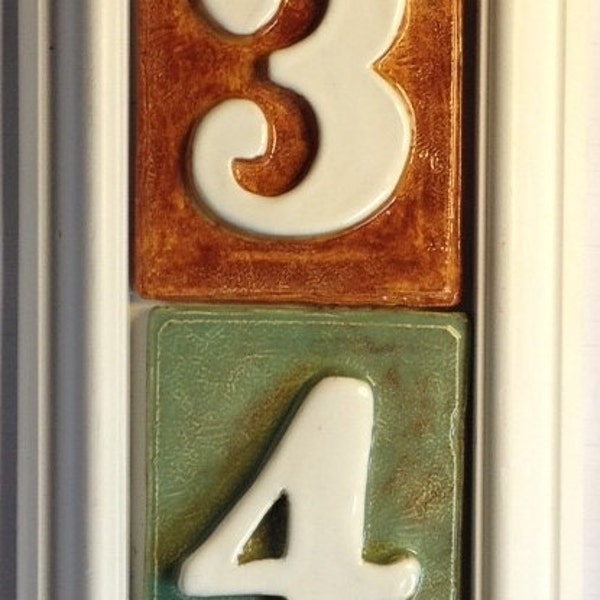 4 number house or home address plaque with tiles.. PVC weatherproof construction, vertical. Your choice of colors.