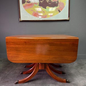 May include: A set of three ceramic mugs with a speckled, matte finish. The mugs are in shades of cream, light gray, and dark gray. Each mug has a simple, minimalist design, perfect for coffee or tea.