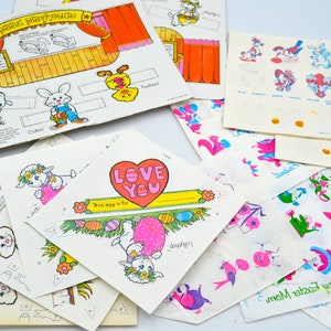 May include: A set of vintage Easter craft paper cutouts featuring bunnies, chicks, and eggs. The paper is white with colorful illustrations and includes instructions for making a playhouse, a love you egg, and other crafts.