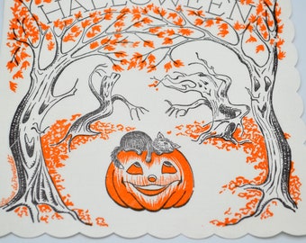 May include: A cream-colored paper napkin with a scalloped edge featuring a black and orange ink illustration of a smiling jack-o'-lantern with a cat resting on top, surrounded by bare trees and autumn leaves, with the text HALLOWEEN at the top.