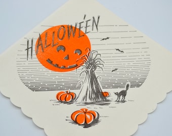 May include: A vintage Halloween party paper plate with an orange jack-o'-lantern face, a black cat, and the word "HALLOWEEN" printed in black.