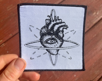 heart atom eye flamgu logo sew on patch black and white science love visionary art
