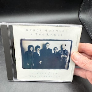 May include: A CD case featuring the album "Scenes from the Southside" by Bruce Hornsby & The Range. The album cover shows a black and white photo of the band members. The text "Bruce Hornsby & The Range" and "scenes from the southside" are visible.