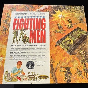 May include: Vintage "Fighting Men" toy set box featuring illustrations of soldiers, a tank, and explosions. The box includes text about bendable soldiers and combat equipment. The box is orange, yellow, and white.