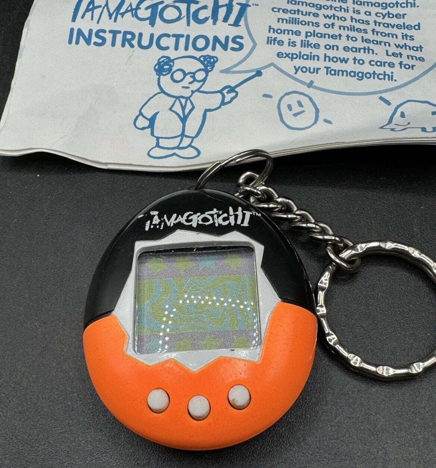 1997 Original Bandai TAMAGOTCHI Electronic Orange & Black Works! W