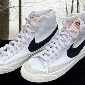 white and black nike blazers
