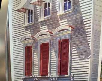 May include: A watercolor painting of a building with red shutters and white awnings. The building is painted in shades of gray and white. The painting is signed "Steven Jordan" and includes the text "Spoleto" and "Charleston, SC".