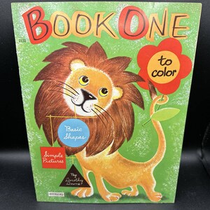 May include: A vintage coloring book with a lion on the cover. The book is titled "Book One to Color" and features the text "Basic Shapes" and "Simple Pictures".
