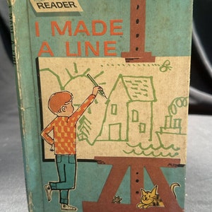 Könnte beinhalten: Ein altes Kinderbuch mit dem Titel "I Made A Line" aus der Wonder Books Easy Reader-Reihe. Der Umschlag zeigt einen jungen Jungen, der ein Haus, Bäume und ein Boot auf ein großes Blatt Papier zeichnet. Das Buch ist in einem farbenfrohen Comic-Stil illustriert.