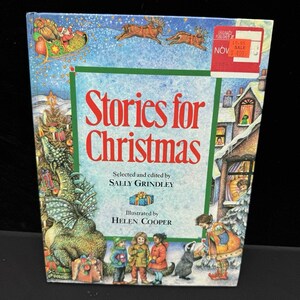 May include: A hardcover book titled Stories for Christmas, selected and edited by Sally Grindley and illustrated by Helen Cooper. The cover features a colorful illustration of a dragon, children, and Santa in a sleigh, with a red sale sticker.