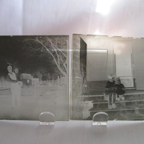 Two Glass Plate Negatives, 1 of 2 Young Girls and 1 of a Man Holding a Child