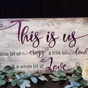 Lovely hand painted wooden sign... This Is Us, a little bit of crazy, a little bit of loud, & a whole lot of love
