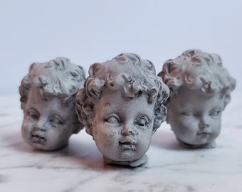 Creepy tiny cherub baby head cement decorations for potted plants or fairy gardens