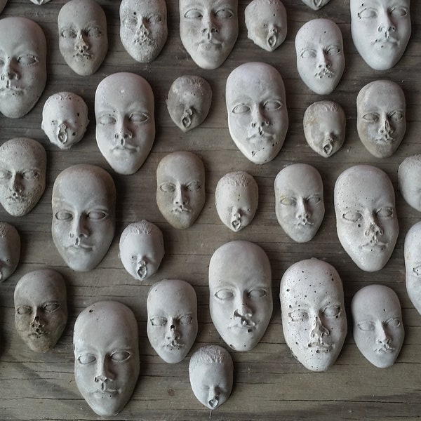 Creepy cement face decorations for potted plants or fairy gardens