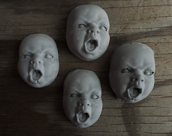 Creepy cement angry face decorations for potted plants or fairy gardens