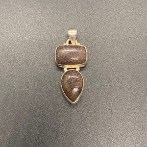High quality dinosaur bone .925 sterling silver pendant