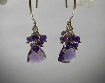 Faceted triangle amethyst earrings. Accented with faceted 2mm amethyst.Faceted gem quality natural beads. Hand made ear wires. February bday
