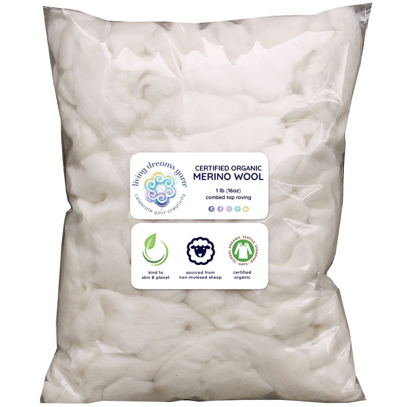 May include: A white plastic bag filled with white, fluffy, certified organic merino wool roving. The bag has a label that reads "Living Dreams Yarn" and "Certified Organic Merino Wool 1 lb (16oz) combed top roving".