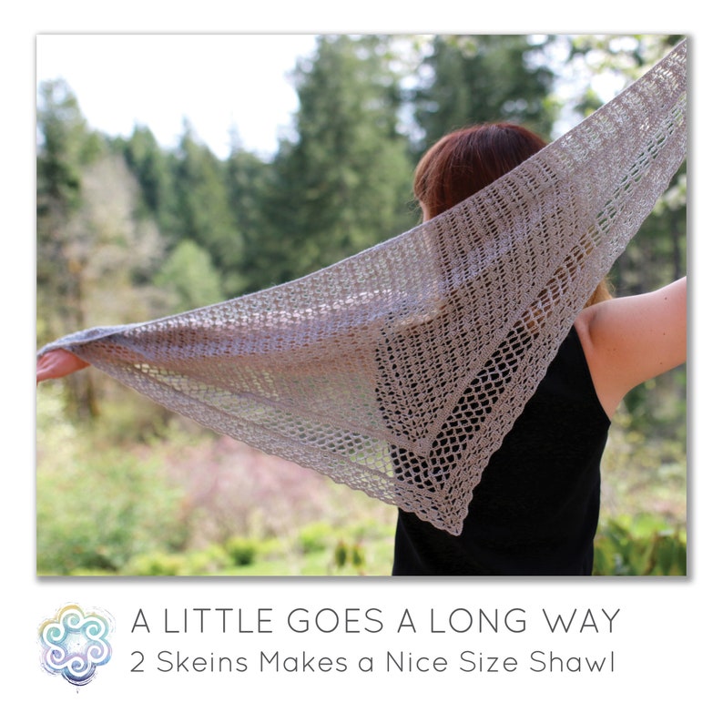 May include: A light gray, open-weave shawl is held up, showcasing its triangular shape and delicate texture. The shawl is displayed against a backdrop of green trees and a blurred background. The text at the bottom reads: "A Little Goes a Long Way, 2 Skeins Makes a Nice Size Shawl."