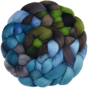 May include: A thick, braided bundle of roving wool fiber featuring a color palette of deep forest green, bright lime green, charcoal gray, sky blue, and dark navy blue. The soft, fluffy texture is arranged in a circular, intertwined pattern.