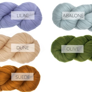 May include: Five skeins of yarn in different colors: lilac, abalone, dune, olive, and suede.