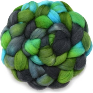 May include: A ball of green, blue, and gray wool yarn. The yarn is braided and twisted into a ball shape.