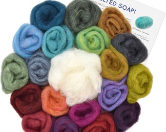 May include: A set of 18 colourful wool rovings for felting soap. The rovings are arranged in a circle, with a white roving in the centre. The rovings are in various shades of blue, green, brown, purple, red, and orange.