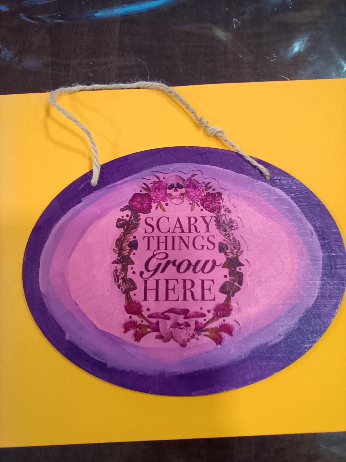 Scary things grow here plaque