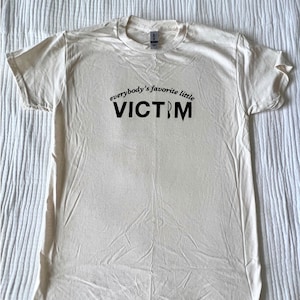 Everybody&#39;s Favorite Little Victim T-Shirt | Classic 90s Horror Movie Final Girl Tee, Spooky Season Apparel Pop Culture/Halloween Lover Gift