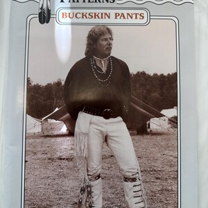 May include: A package for "Missouri River Patterns" featuring a sepia-toned image of a person wearing buckskin pants. The pants have fringe and decorative stitching. The text "BUCKSKIN PANTS" is displayed prominently.