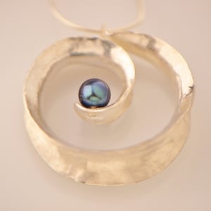 Spiral sterling silver pendant with blue freshwater pearl