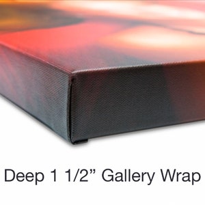 May include: Close-up of a canvas print with a deep 1 1/2" gallery wrap. The canvas is stretched over a wooden frame and the edges are painted black.