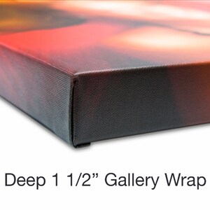 May include: Close-up of a canvas print with a deep 1 1/2" gallery wrap. The canvas is stretched over a wooden frame and the edges are painted black.