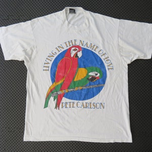 Screen Stars Best Vintage White T-Shirt living in the name of love Pete Carison Parrots Size XL