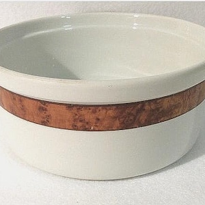 May include: White ceramic bowl with a brown band around the top.