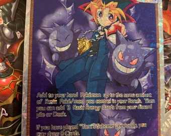 Op de afbeelding: Een Pokémon-verzamelkaart met Yugi's Vriendschap, een Supporter-kaart waarmee je Pokémon aan je hand kunt toevoegen en kaarten kunt trekken. De kaart toont Yugi Moto uit de anime-serie, omringd door twee Gengar-Pokémon.
