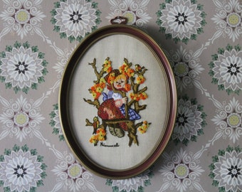 Vintage Completed Oval Embroidery Picture of Hummel Girl, Needlepoint of Girl on Tree Swing with Orange Flowers in Oval Frame, 1970s Crewel