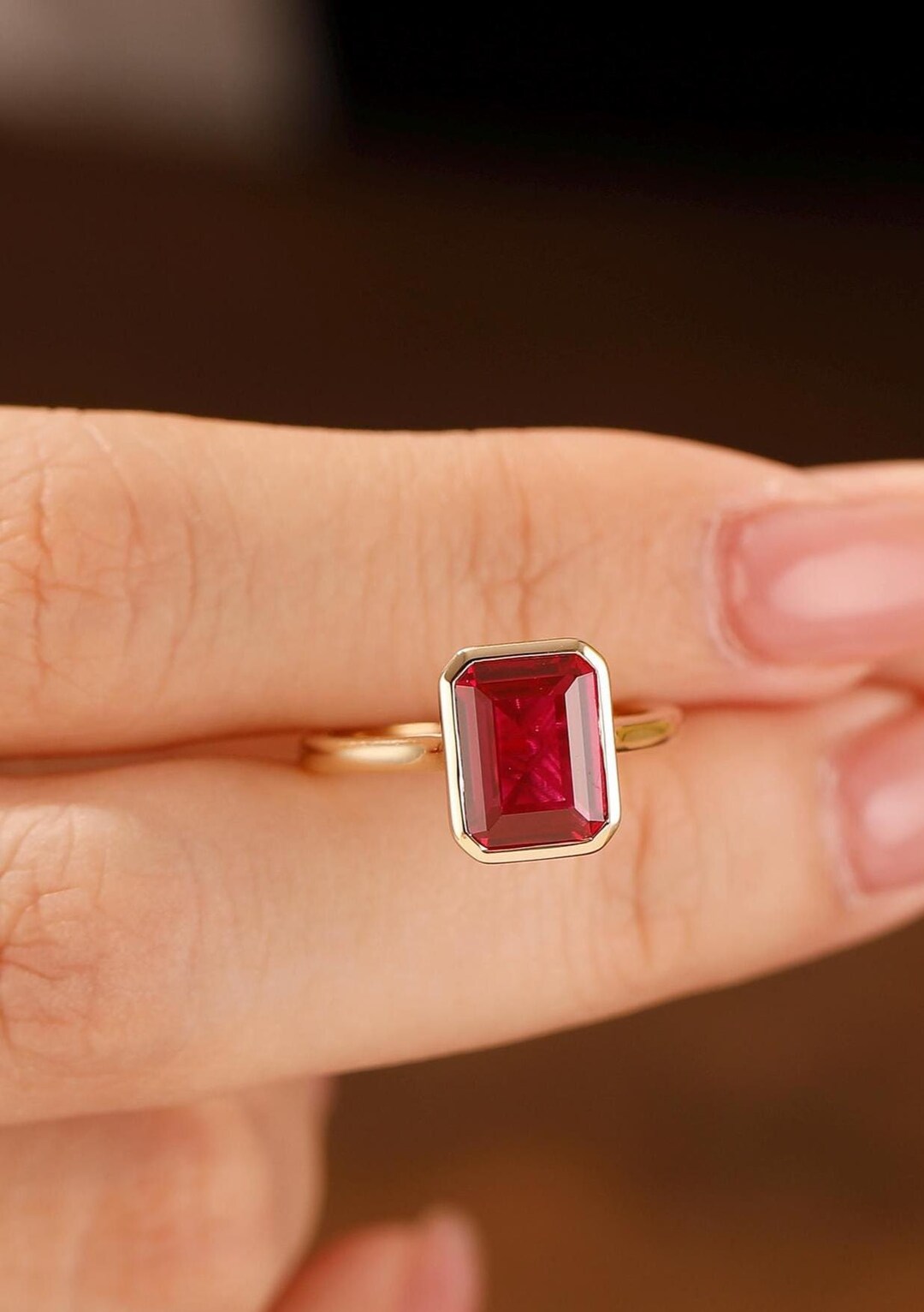 emerald cut ruby and diamond ring yellow gold