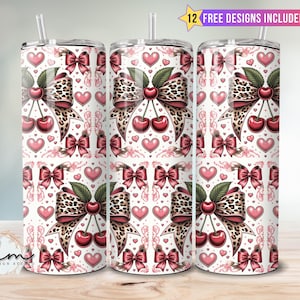 May include: Three stainless steel tumblers with a repeating pattern of cherries, leopard print bows, and pink hearts on a white background. Each tumbler has a clear straw and the text "12 FREE DESIGNS INCLUDED".
